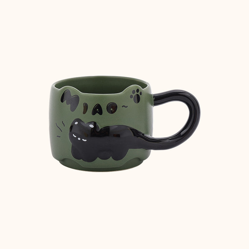Dark green black cat ceramic mug on a plain cream background - 3D relief black cat draped around the body, cat-ear rim, glossy black tail handle, and hand-painted MIAO lettering