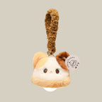 Calico cat plush night light charm on a beige background - cream and caramel fluffy cat topper with big glossy eyes, warm white LED bulb glowing underneath, and a fluffy caramel hang loop