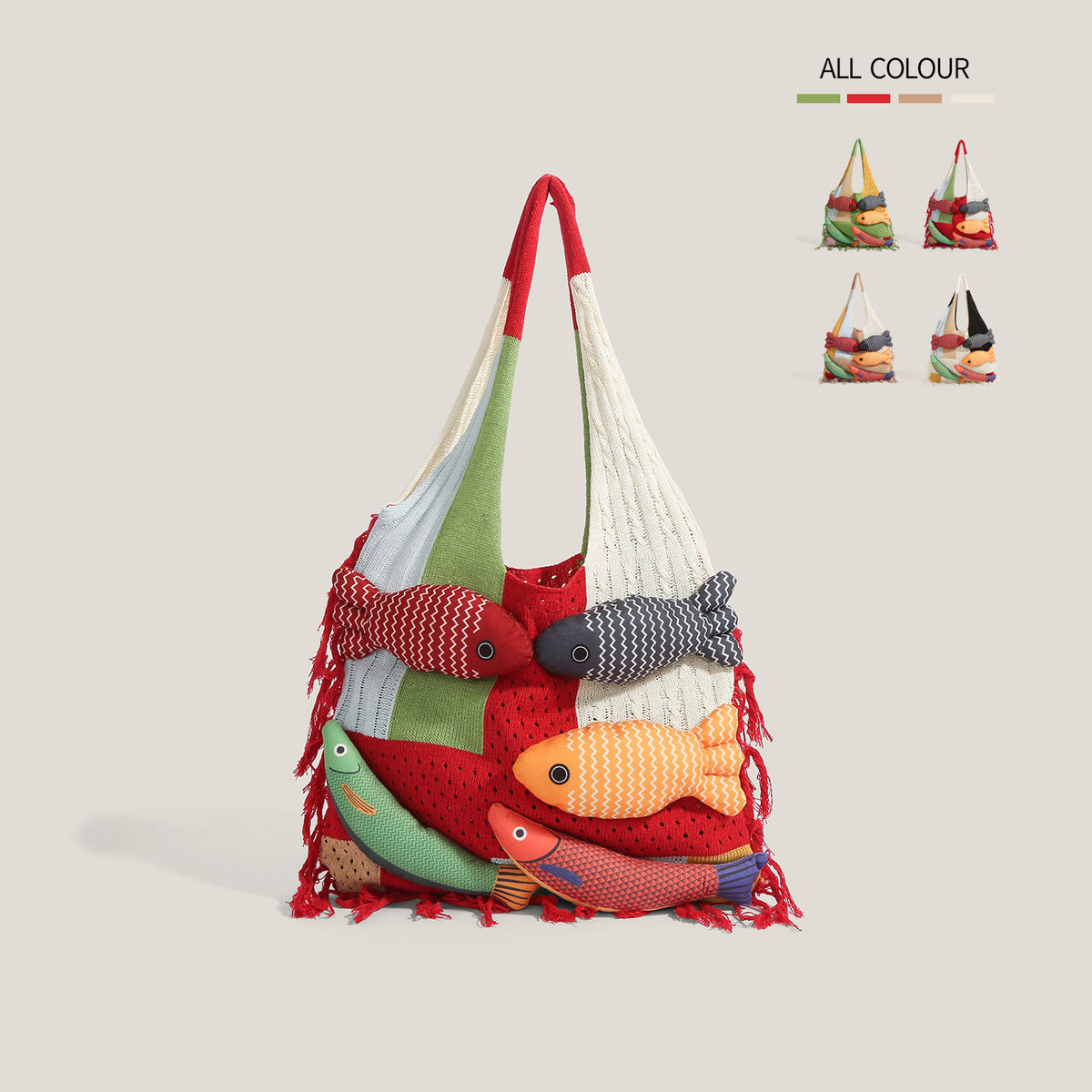 Red knitted fish tote bag on a beige background - festive red, cream and green patchwork crochet panels, five plump stuffed 3D fish appliques, red fringe at the hem, ALL COLOUR swatch chart in the corner