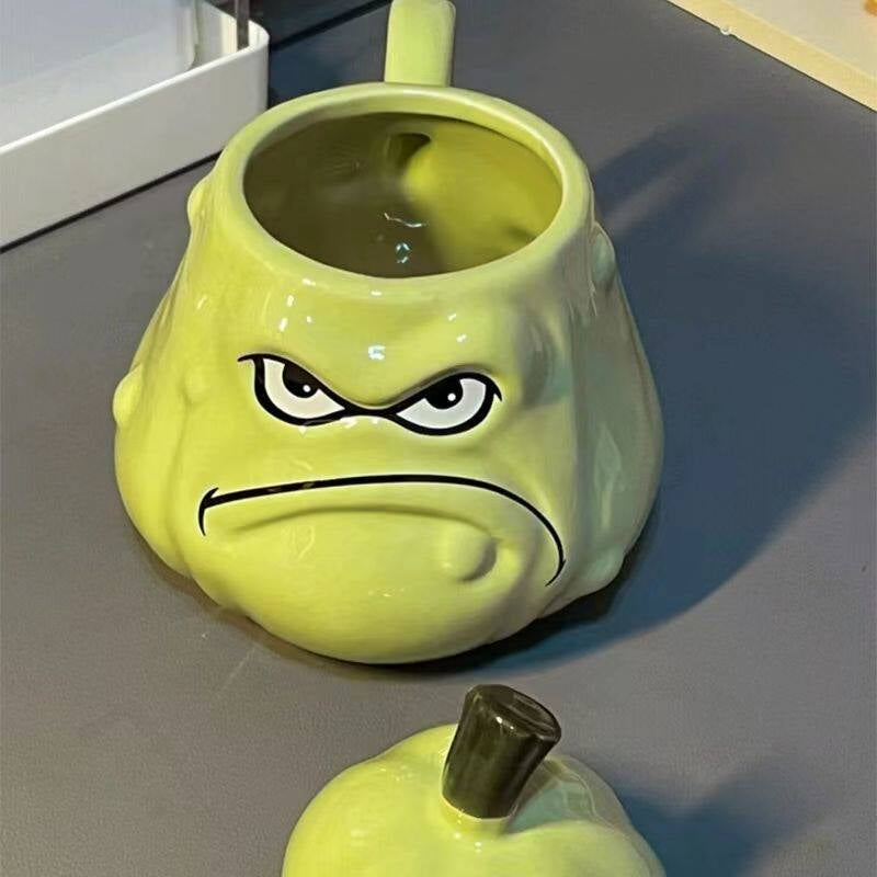 Grumpy melon mug with its lid off, showing the wide 6.3cm mouth and generous 550ml interior of the 3D sculpted green melon ceramic cup - glossy glaze, frowning face, and stem lid in the foreground