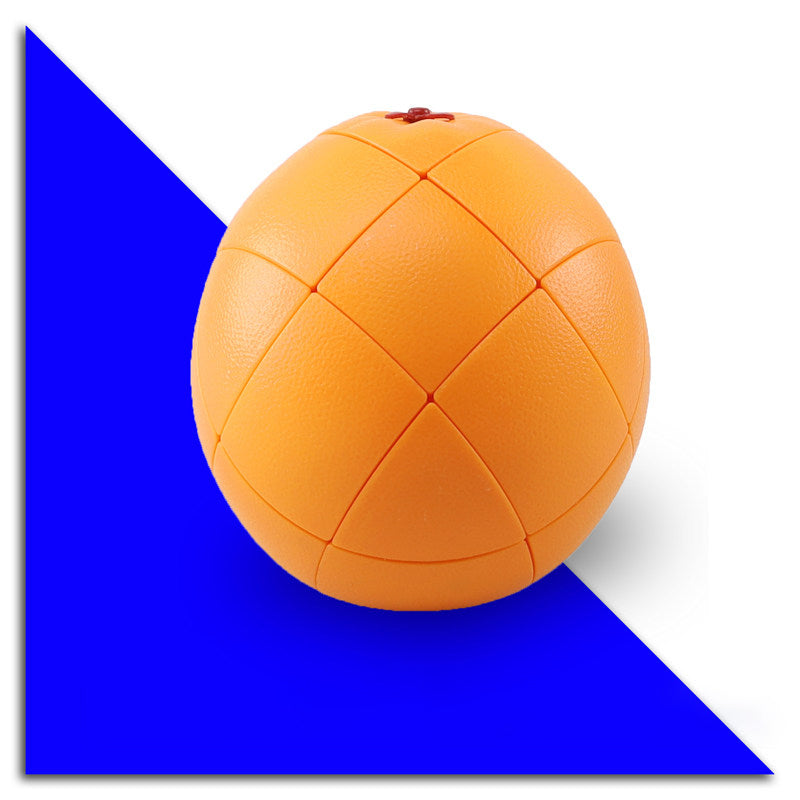 Orange shape cube puzzle on a blue background - 3x3 twisty cube moulded as a dimpled orange with a red stem, stickerless orange panels showing the puzzle seams