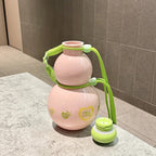 Sweet Pink gourd water bottle standing on a marble counter with its green lid removed and placed beside it - showing the wide bottle mouth, pink PC body with FULL LOVE prints and the green braided crossbody strap