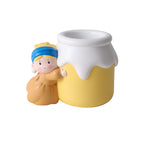 Girl with a Pearl Earring vase shown empty as a pen holder on a white background - resin girl in blue headscarf hugging the yellow milk-jar vase with open wide mouth, showing its use as a desk organizer