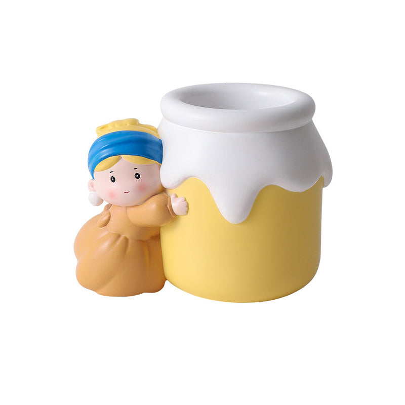 Girl with a Pearl Earring vase shown empty as a pen holder on a white background - resin girl in blue headscarf hugging the yellow milk-jar vase with open wide mouth, showing its use as a desk organizer