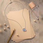 Dancing Heart sterling silver necklace with blue cubic zirconia moon and star pendant