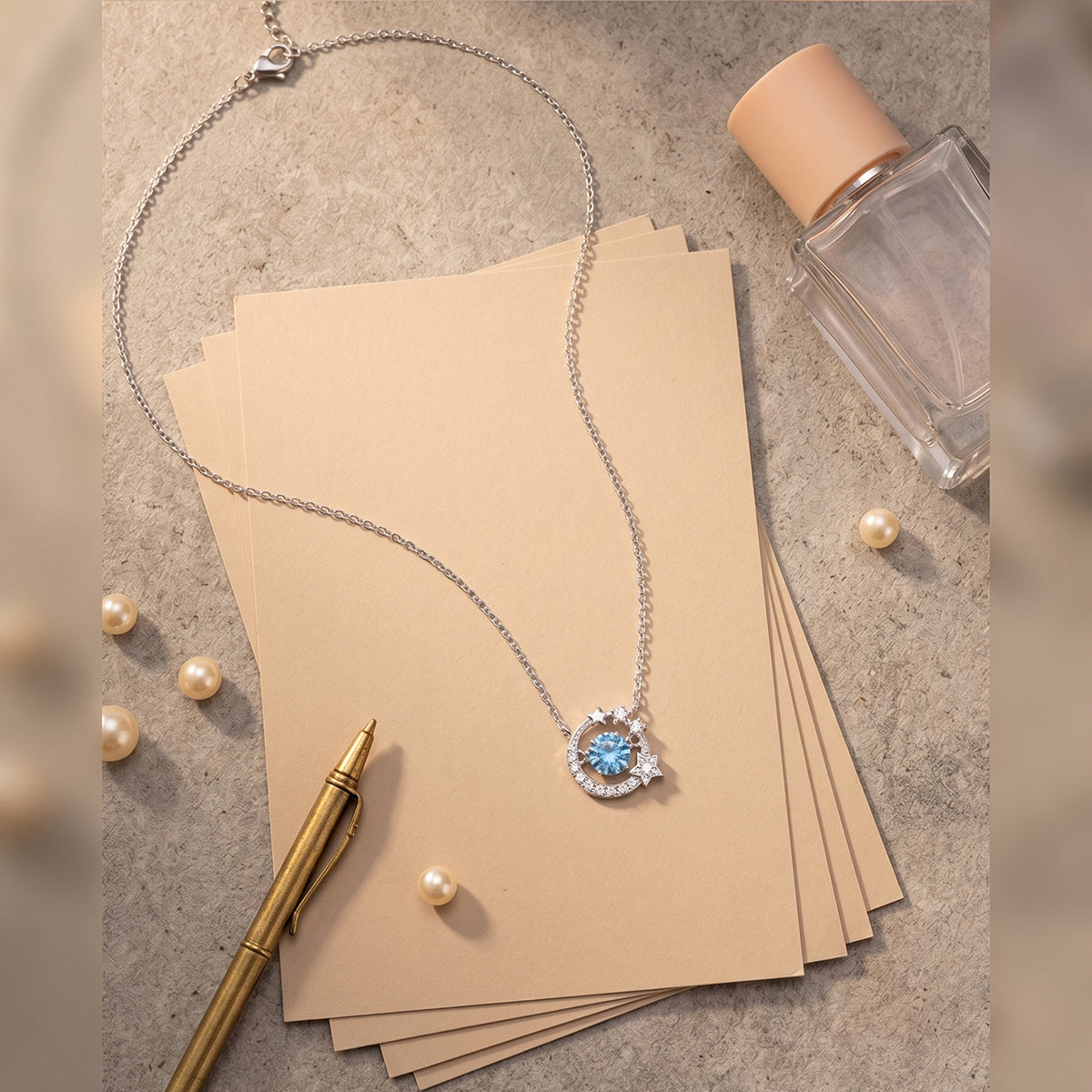 Dancing Heart sterling silver necklace with blue cubic zirconia moon and star pendant