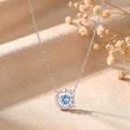 Dancing Heart sterling silver necklace with blue cubic zirconia moon and star pendant