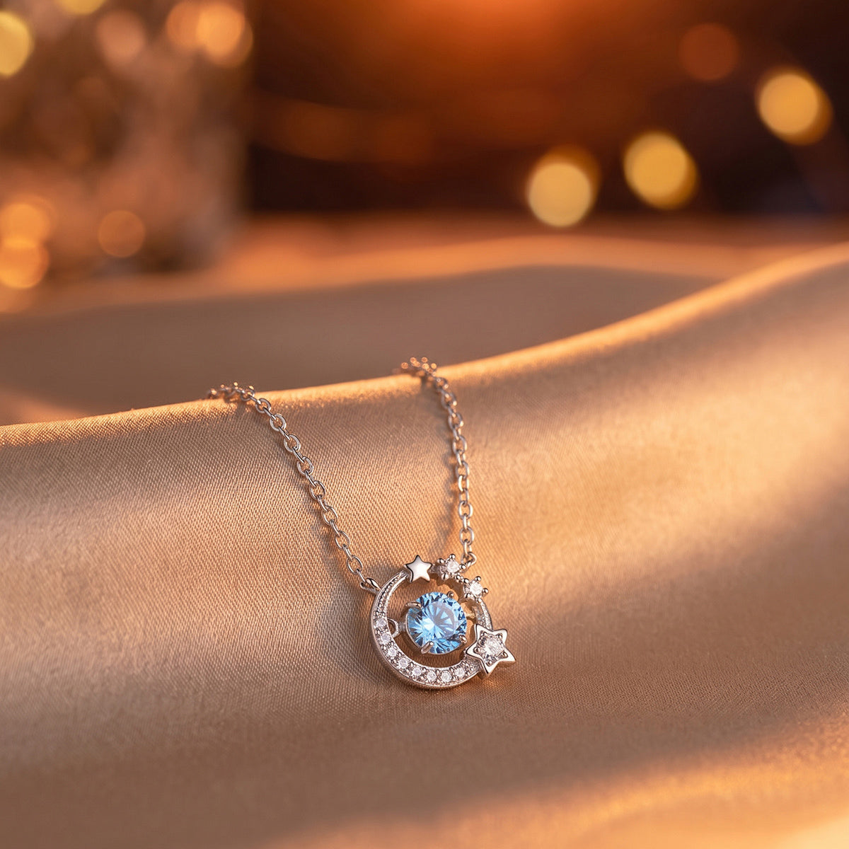 Dancing Heart sterling silver necklace with blue cubic zirconia moon and star pendant