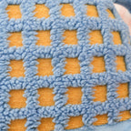 Plush monster character pillow close-up detail, soft polyester fiberfill and pastel color, huggable back cushion for adults and teens